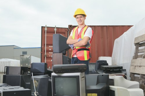 Volunteers receiving donated furniture at a charity reuse centre