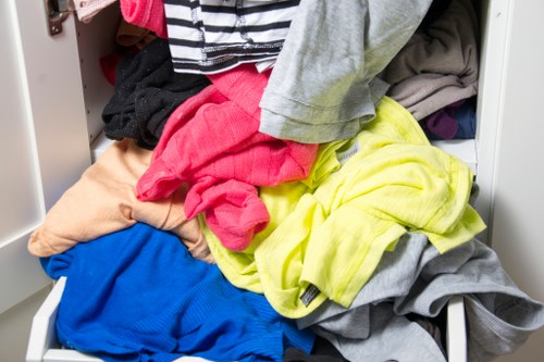 Pile of household items ready for removal in a Kensington flat
